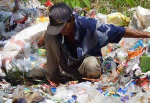 Sorting through plastic garbage, an open dump on a school ground in Banjarmasin, South Kalimantan, November 2012